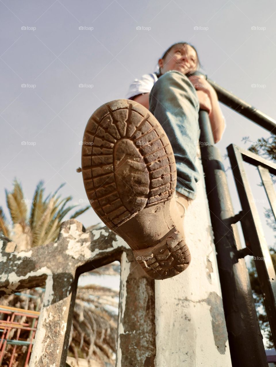 Sitting on concrete wall, upper view