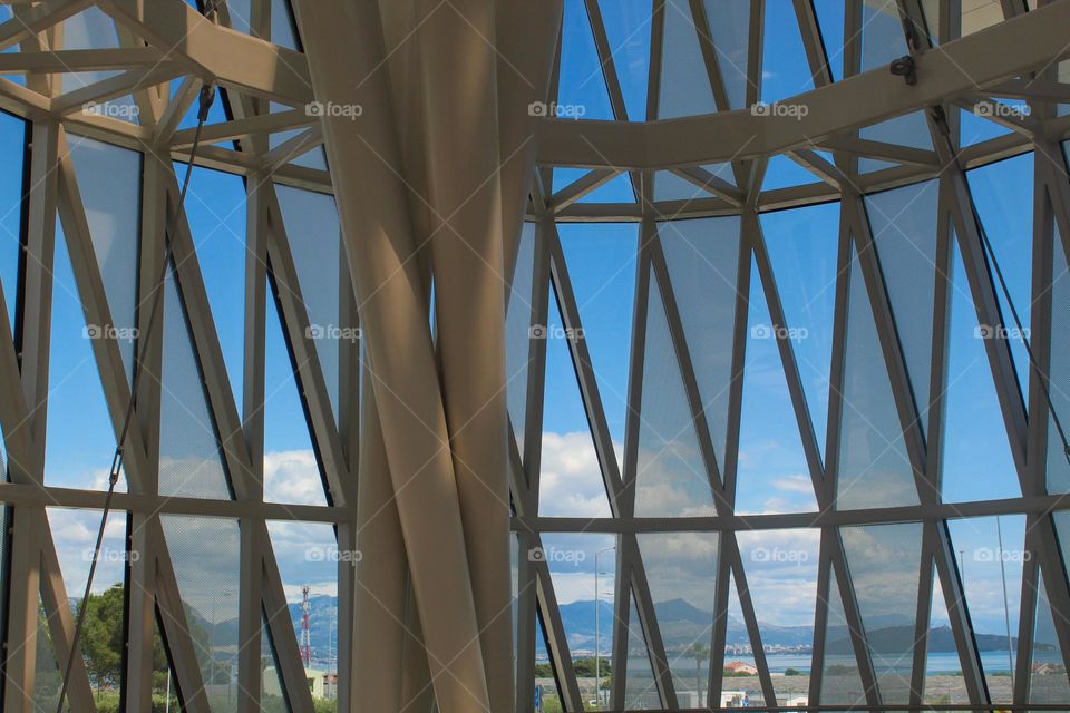 Details of the metal glass wall with a view.  Split airport