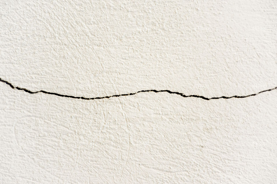 Close-up of white wall with cracked