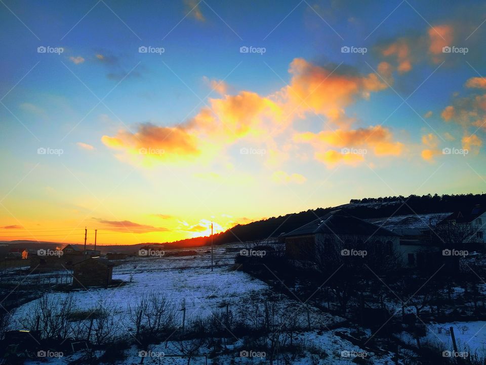 sunrise vs sunset by foaр missions,sunset, the sun leaves beautifully behind the hills of the forest illuminating the sky with yellow rays.