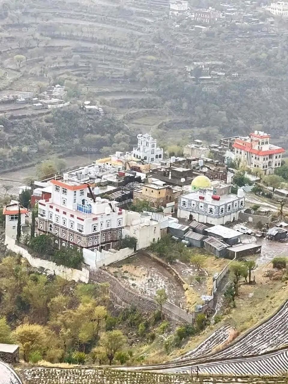A stunning view of green mountains covered in fog in Yemen