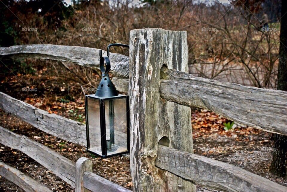 Lantern on fence