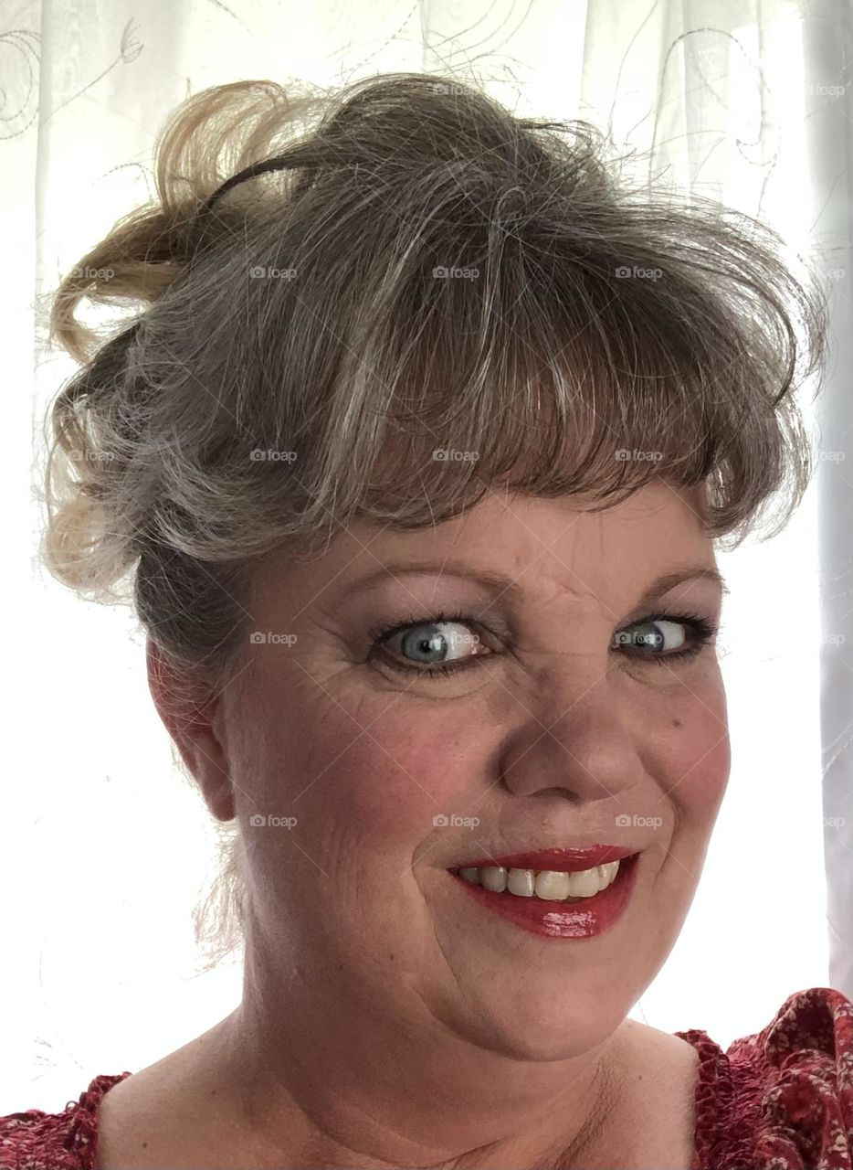 49 year old woman with her hair up