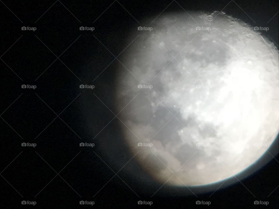 Moon view through the lens of a telescope 