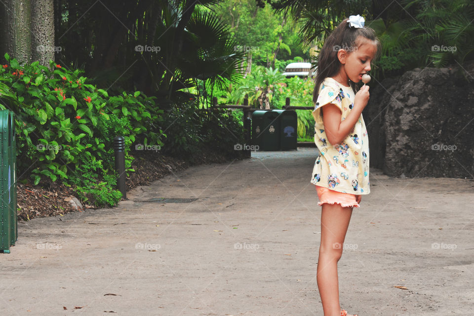 child at disney with food