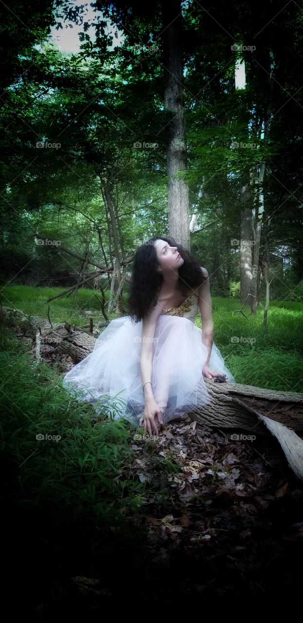 pensive princess in woods