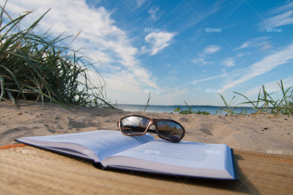 at the beach reading a book