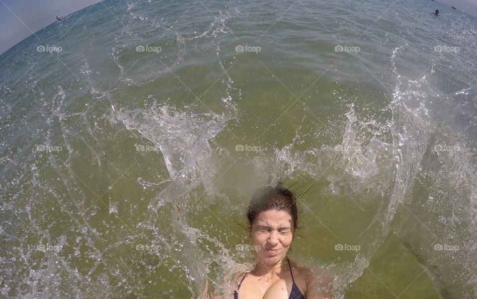 A woman falling in the sea