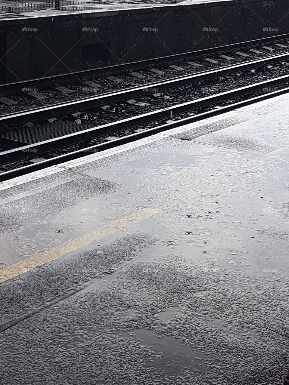 Rain on a railway platform