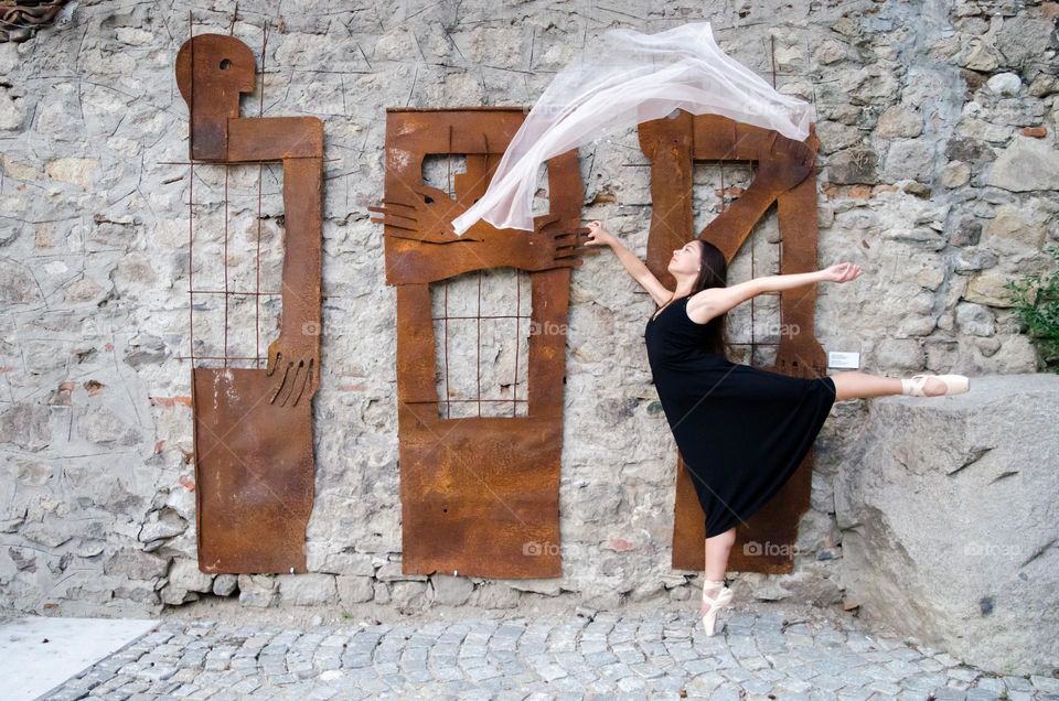 Young Female Ballerina Dancing with a Scarf Outside