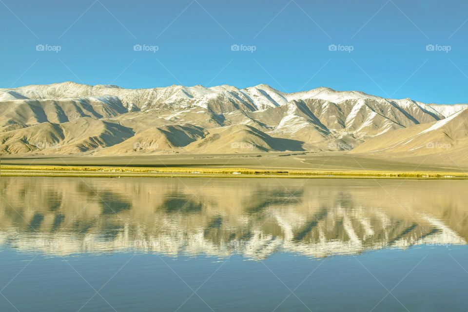 the first snow fall on mountain landscape of laddakh , the start and the end of season.
