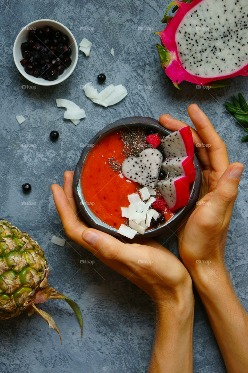 holding smoothie bowl