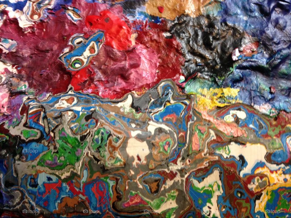 Layers of paint built up on a palette 