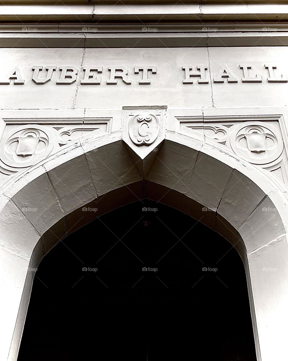 A college building’s entrance - a stone archway.