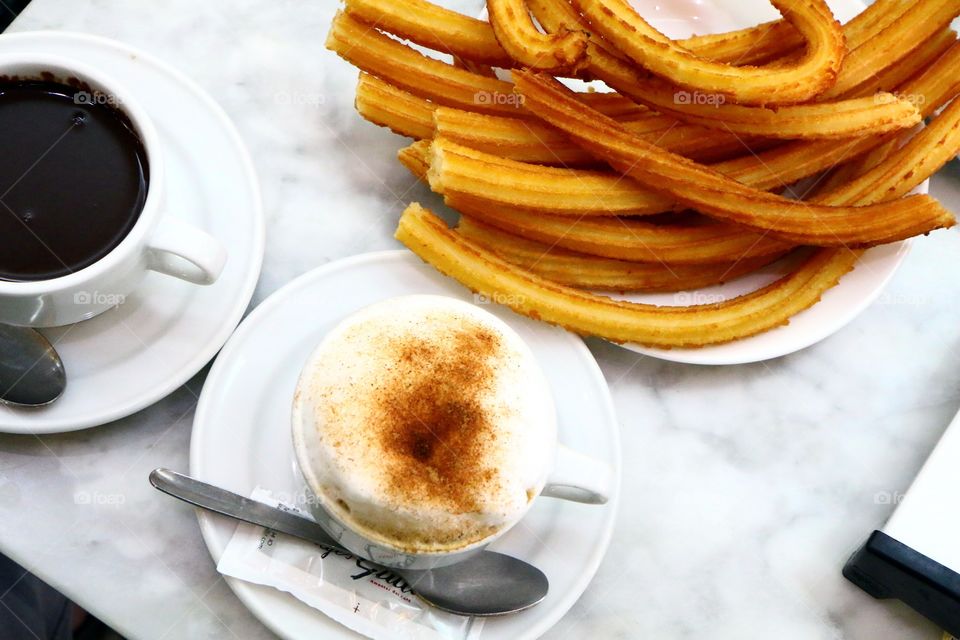 Elevated view of churros with chocolate