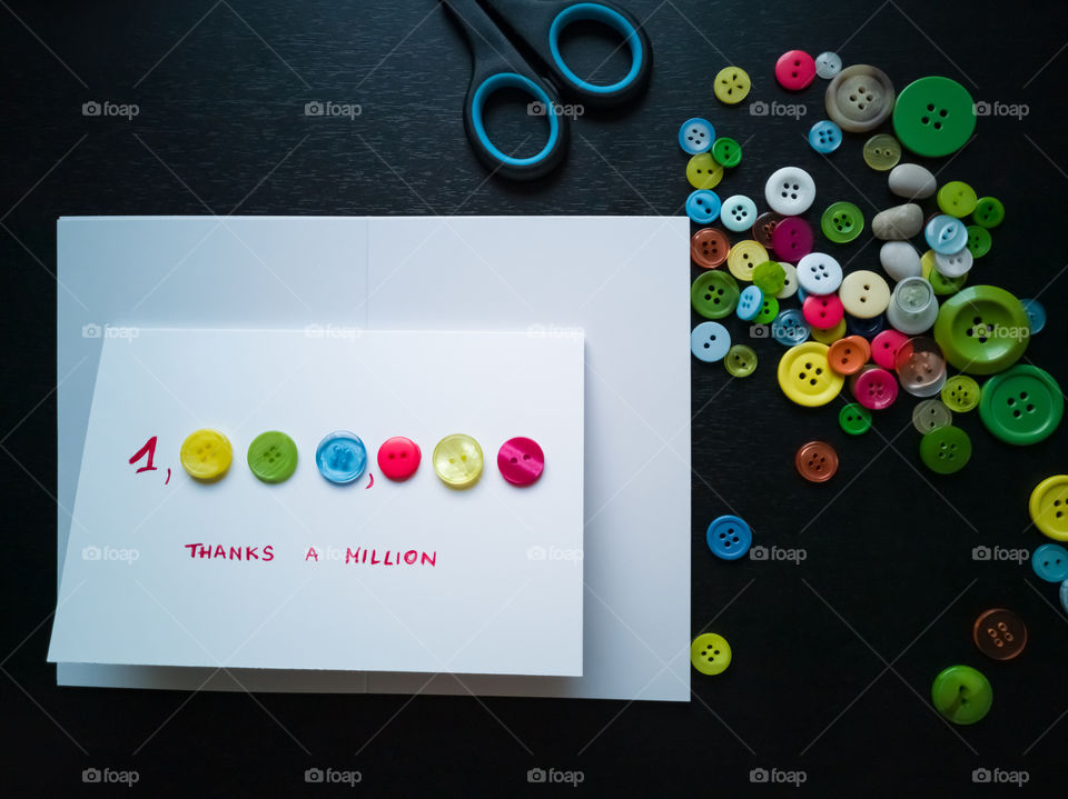 Thank you card made-up from colorful buttons. Thanks a million