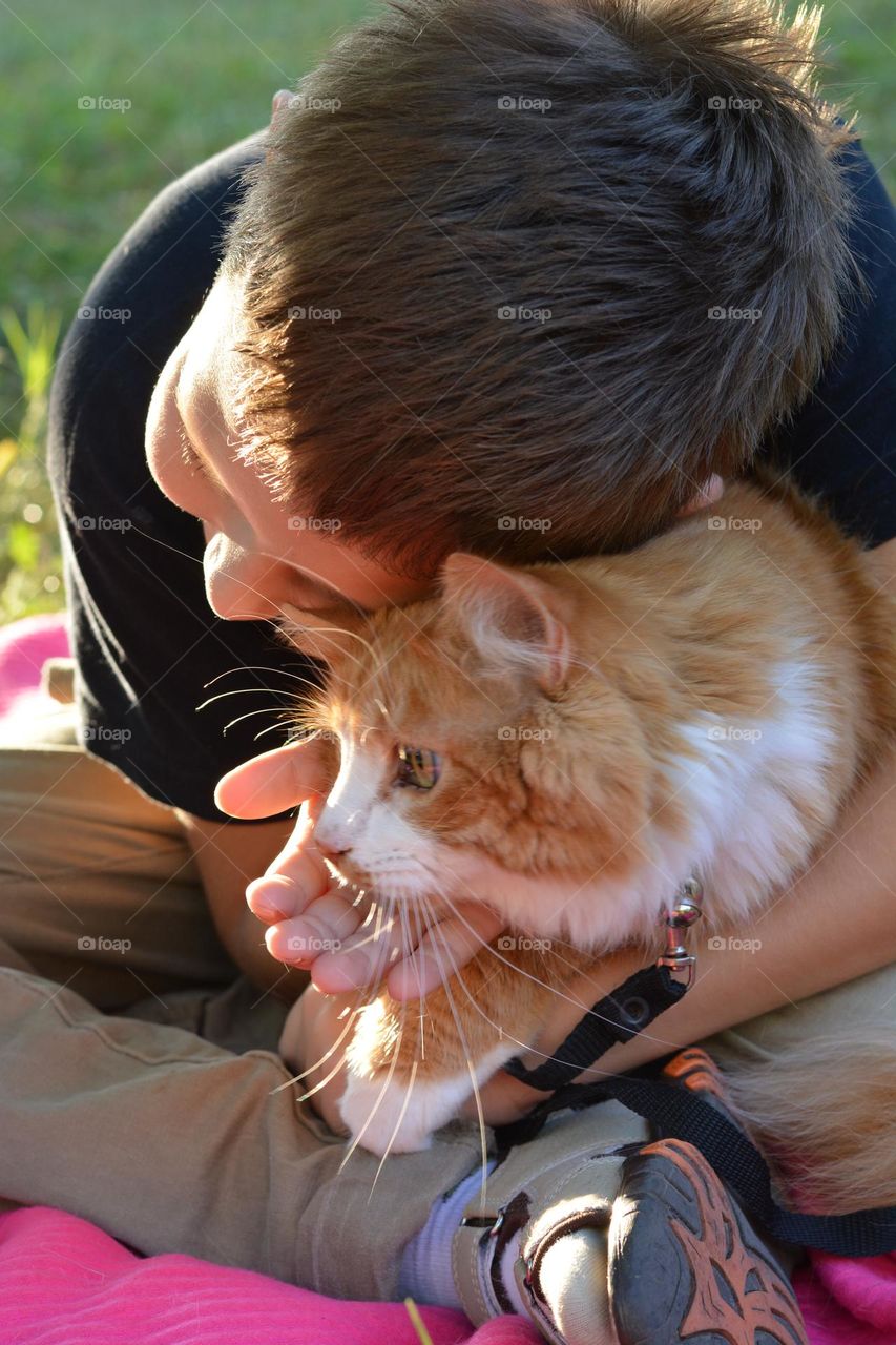 child with cat ❤️😺 in sunlight outdoor