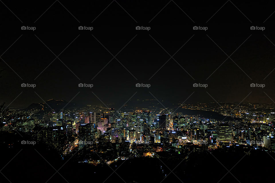 Aerial view of cityscape at night
