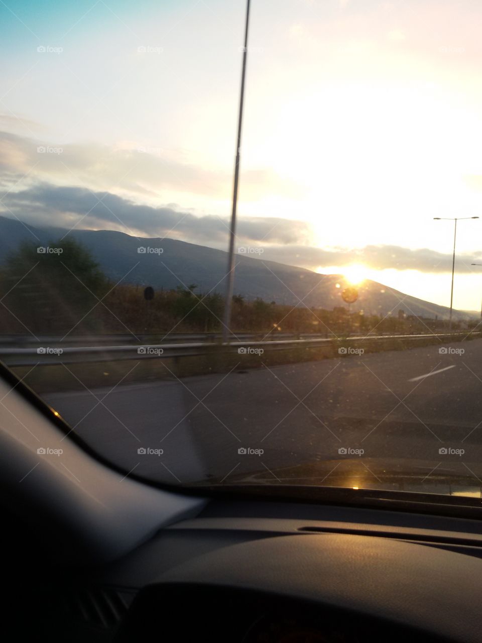 Sunset on the highway from car