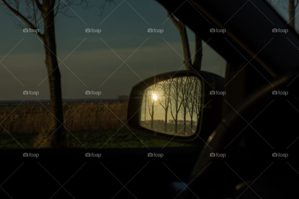 A beautiful reflection in the side mirror of the car