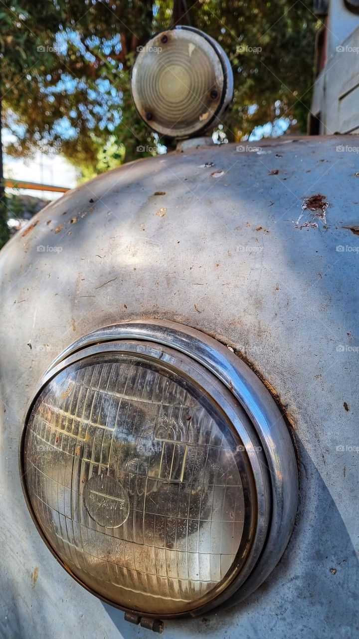 circular headlights of a old truck.