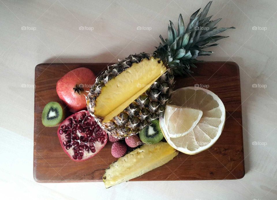 pineapple, pomelo, pomegranate, kiwi, lychees