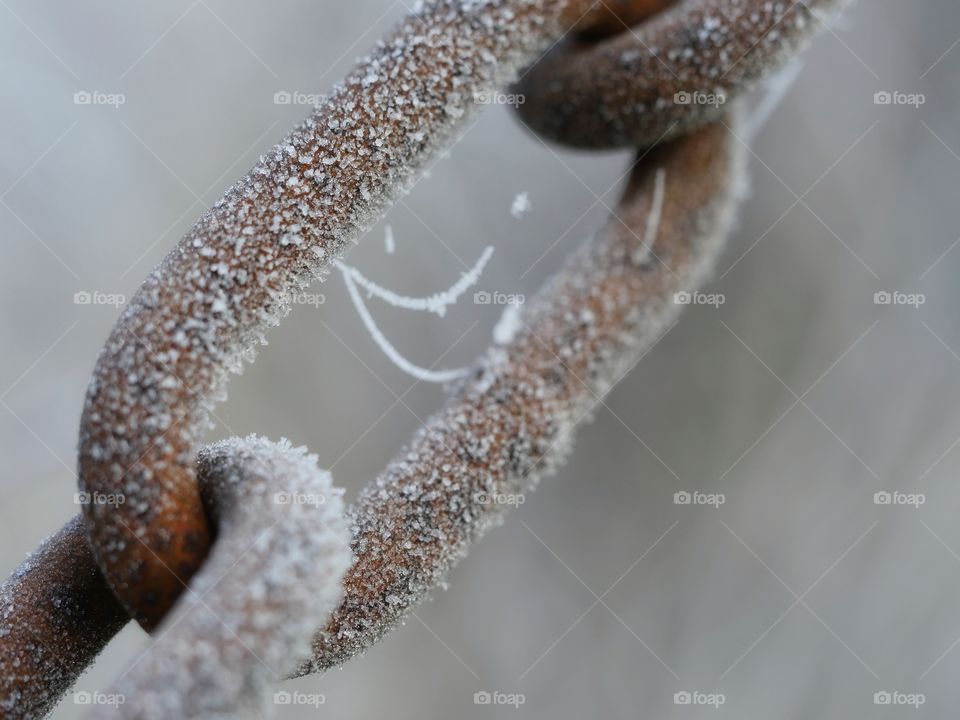 Close up of frozen  rusty chain link