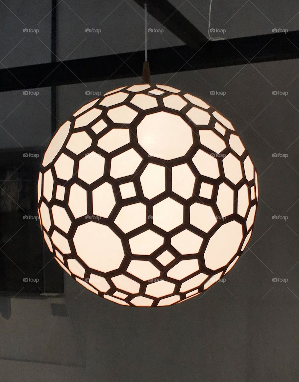 Close up view of the round sphere circle shape lamp with metal patterned frame