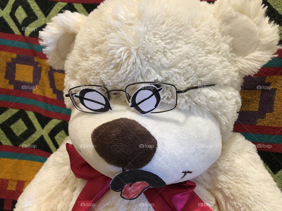 Disgust expression on Teddy Bear wearing glasses