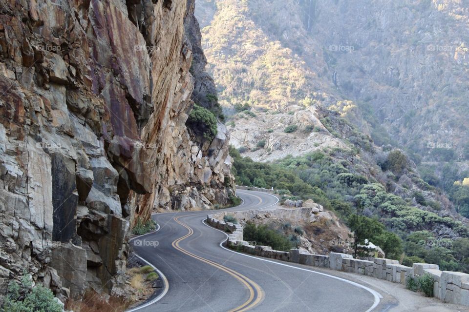 Rocky road through canyon, swerving 