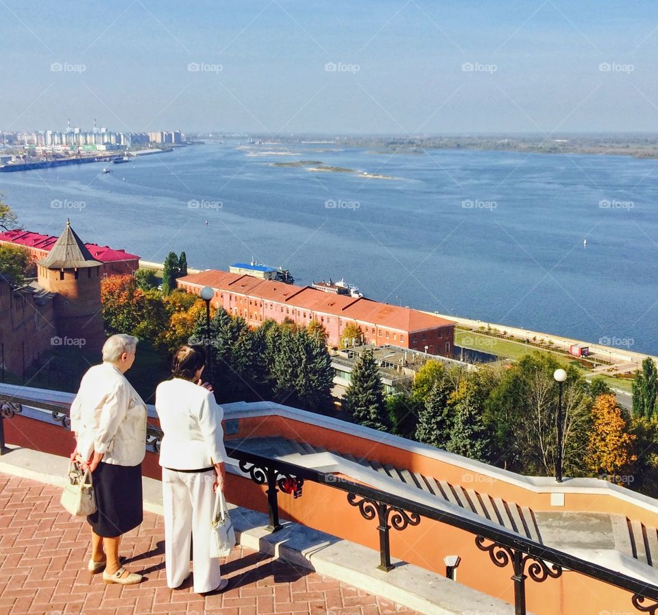 Two old ladies are looking at Volga River. Nizhni Novgorod, Russia. 