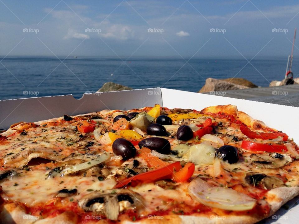 Pizza by the ocean.