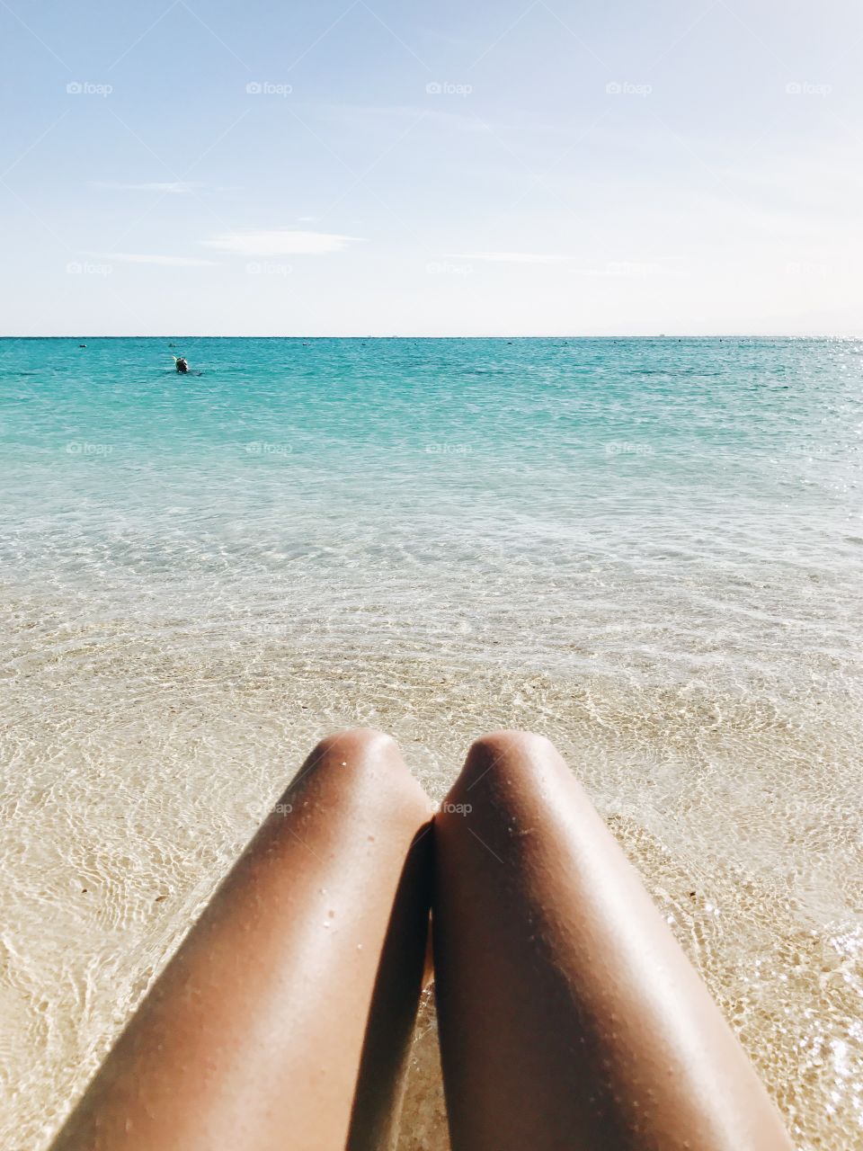 Legs by the ocean