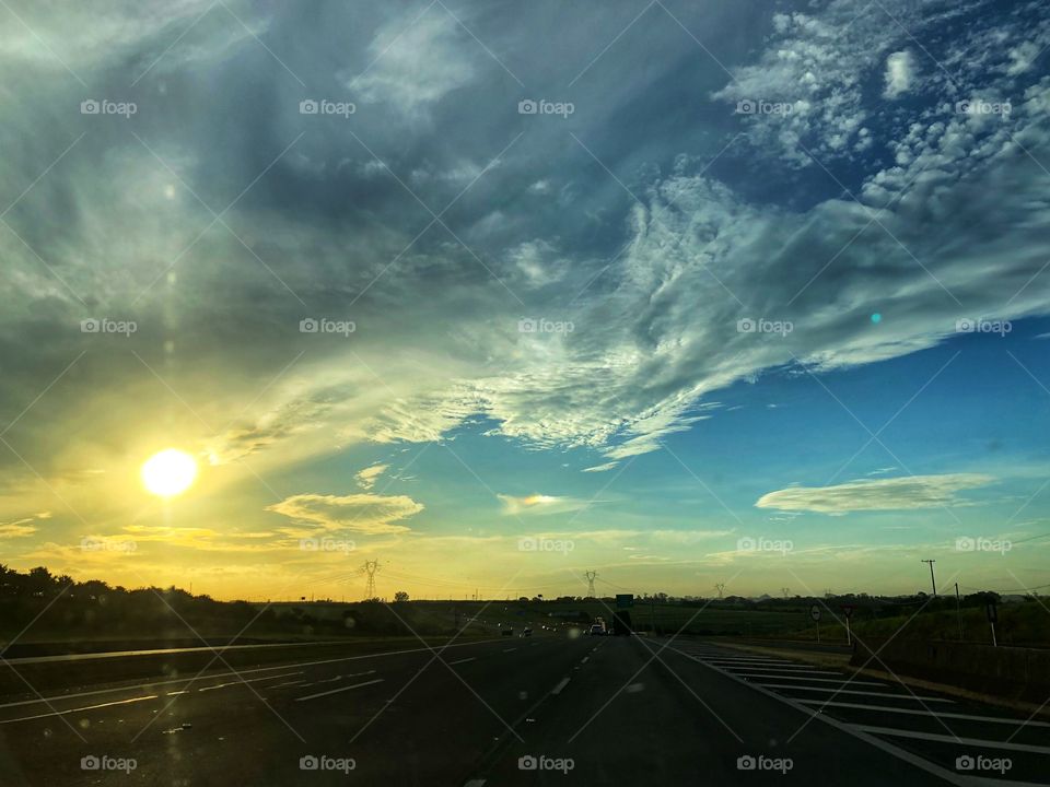 Sunset of an Autumn Day, saw from the Highway, while going back home after a long day working. A very different cloud formation contributing to this beautiful scene.