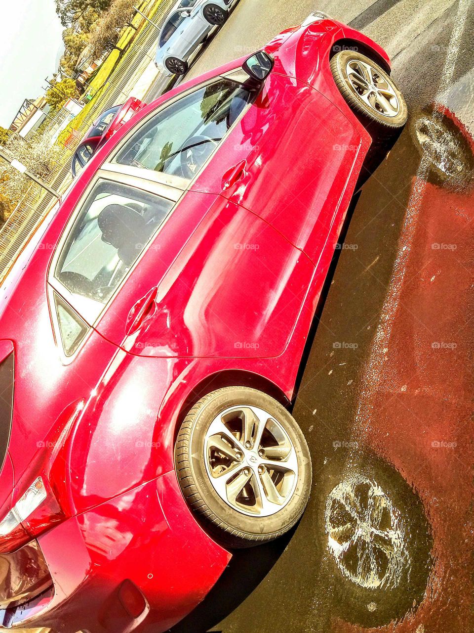 car with puddle reflection