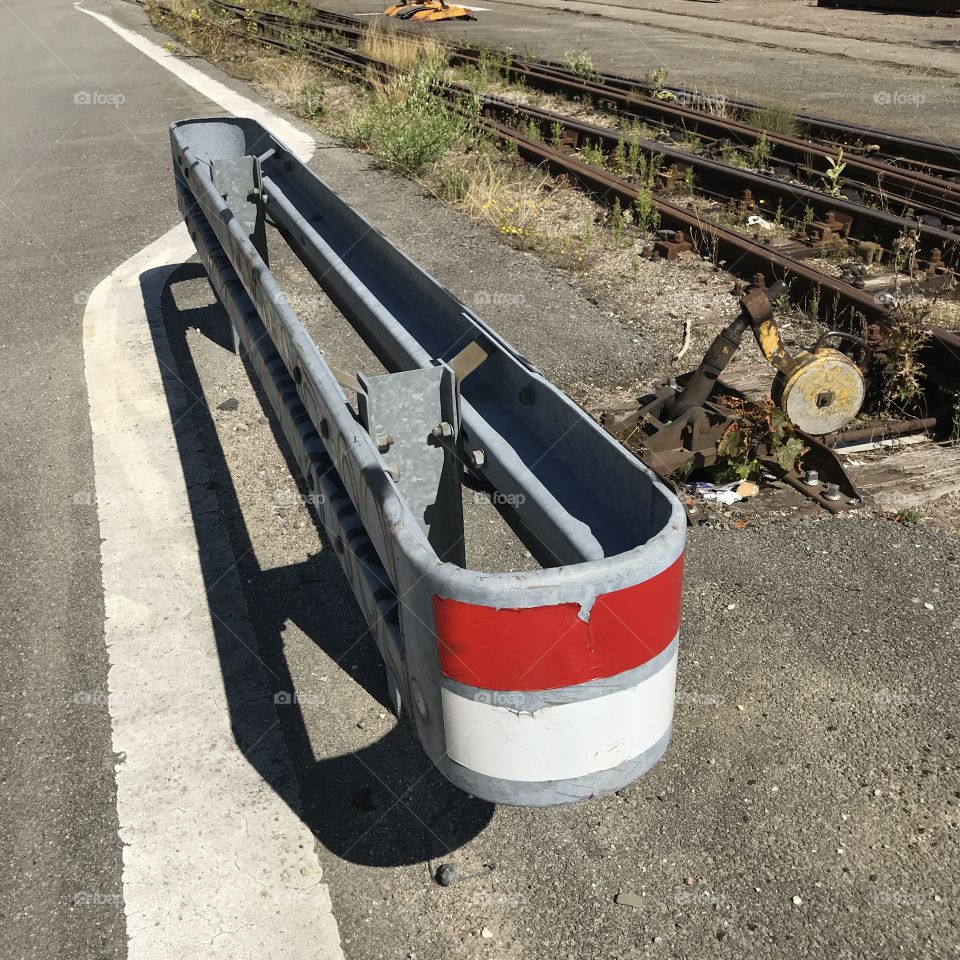 Old barrier with red and white reflectors 
