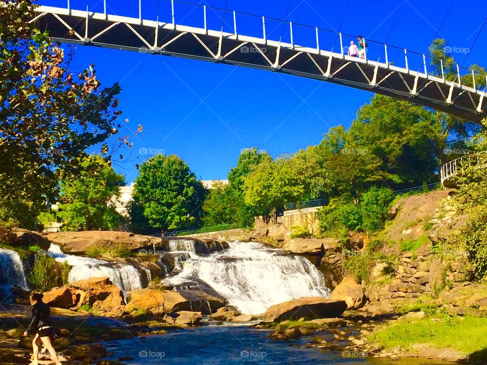 Falls park :) on top is the liberty  bridge 