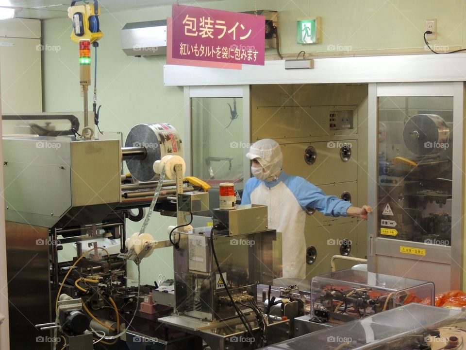 Factory food prep on Japan. Workers preparing food for factory 