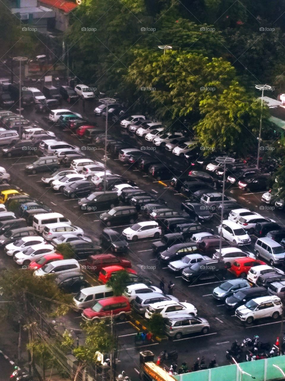 Rows of parked cars of various types, in the middle of metropolitan jakarta indonesia