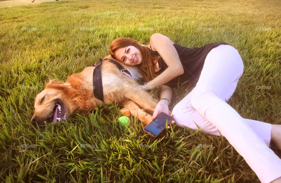 Woman lying with her dog