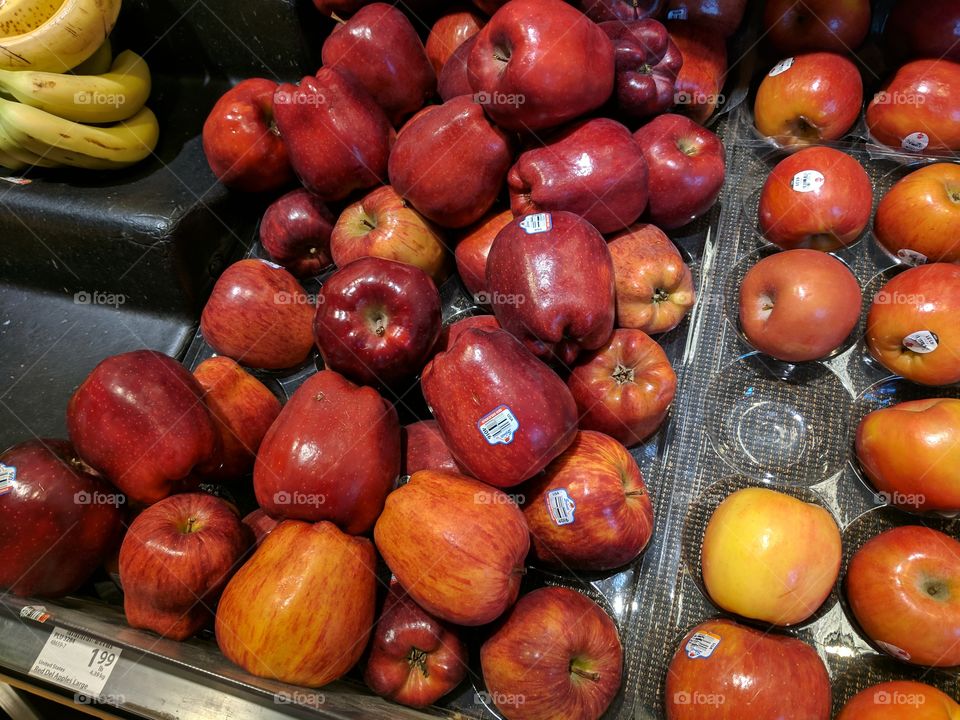produce Shelf full of red delicious apples