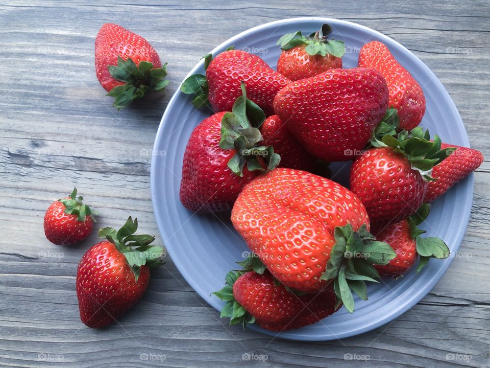 Plate with local fresh strawberries 