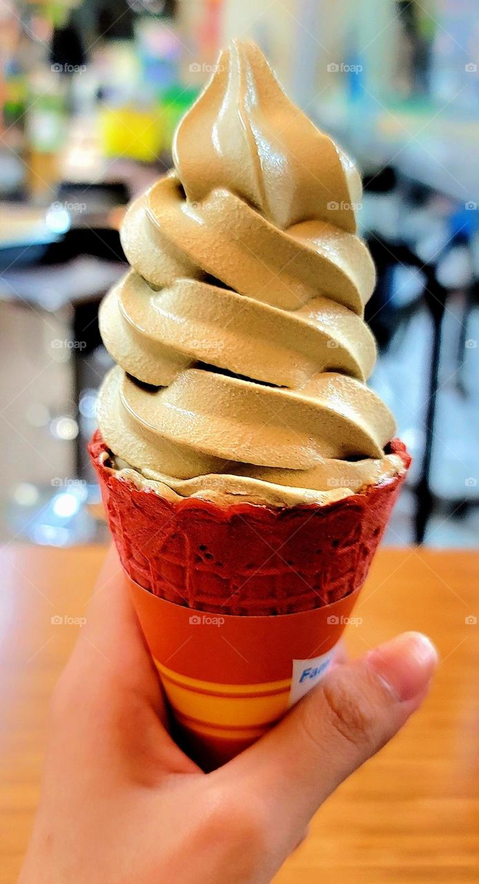 Oolong tea flavored ice cream with lychee aroma. fall color. autumn color.  Waffle Cone