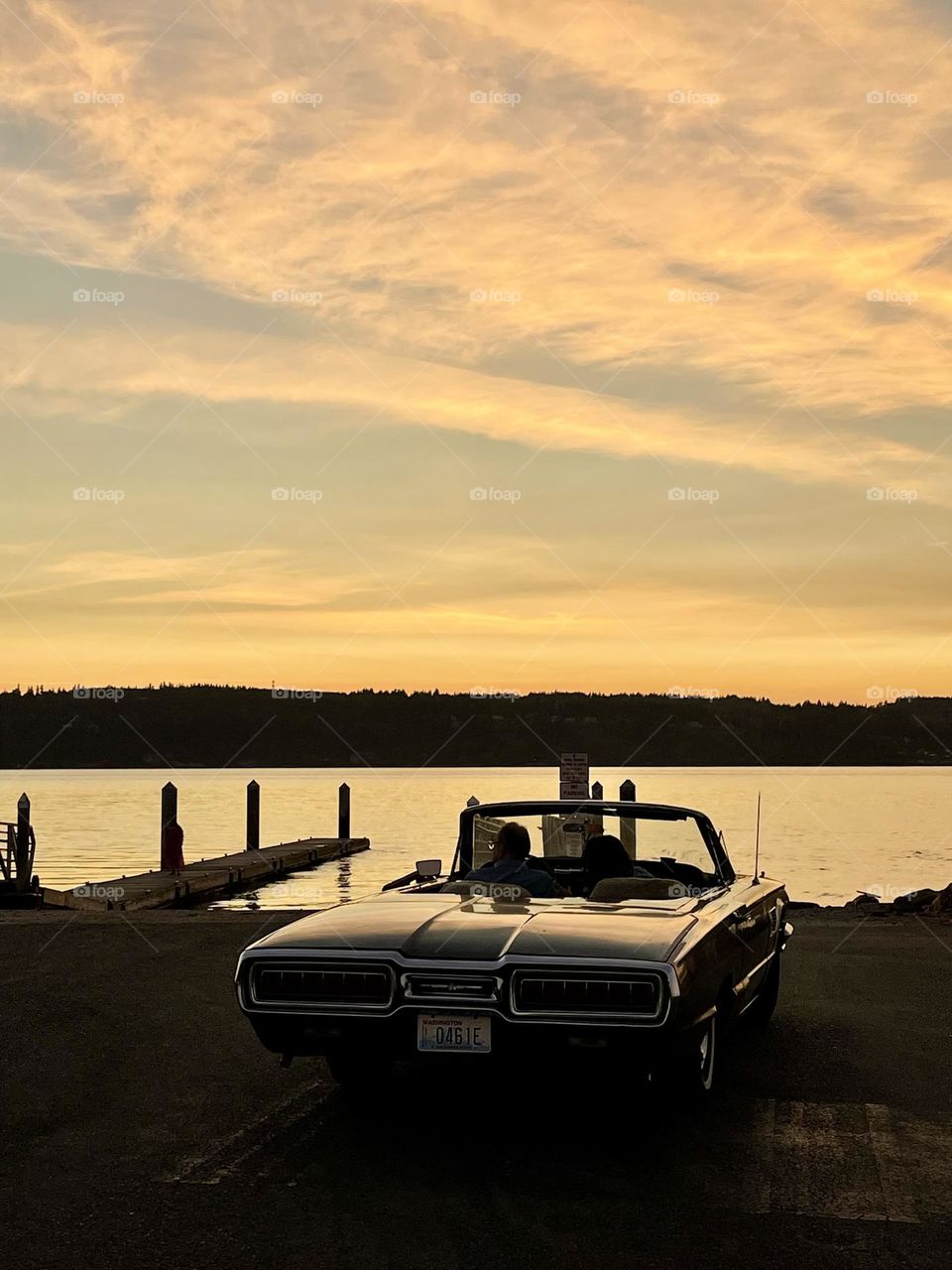 Retro car at the sunset beach 