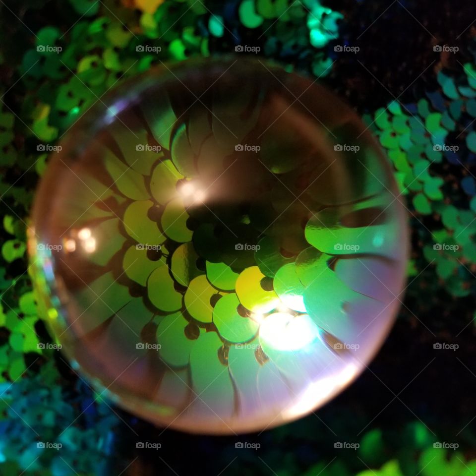 crystal ball on green sequins