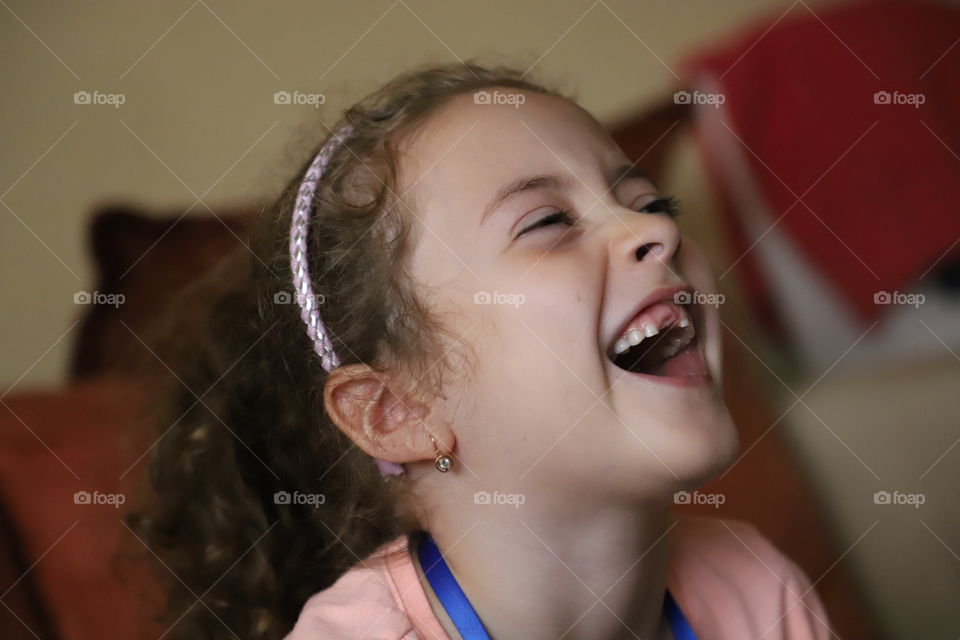 Happy little girl laughing 