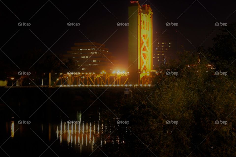 night photography. Golden bridge. Lights. Reflection. Enjoying the view of the golden bridge at night time in Sacramento California.