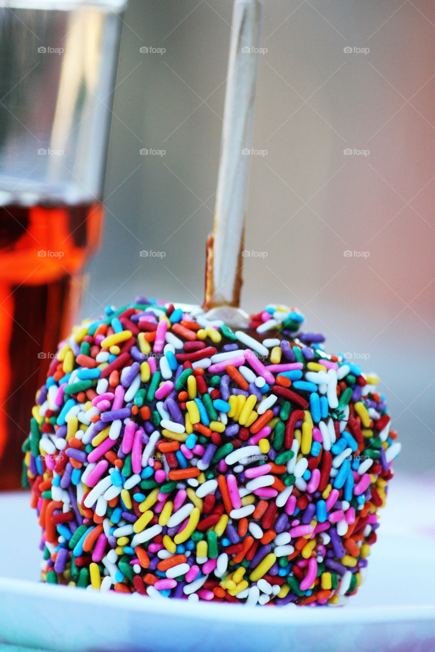 Candied apple with colorful sprinkles