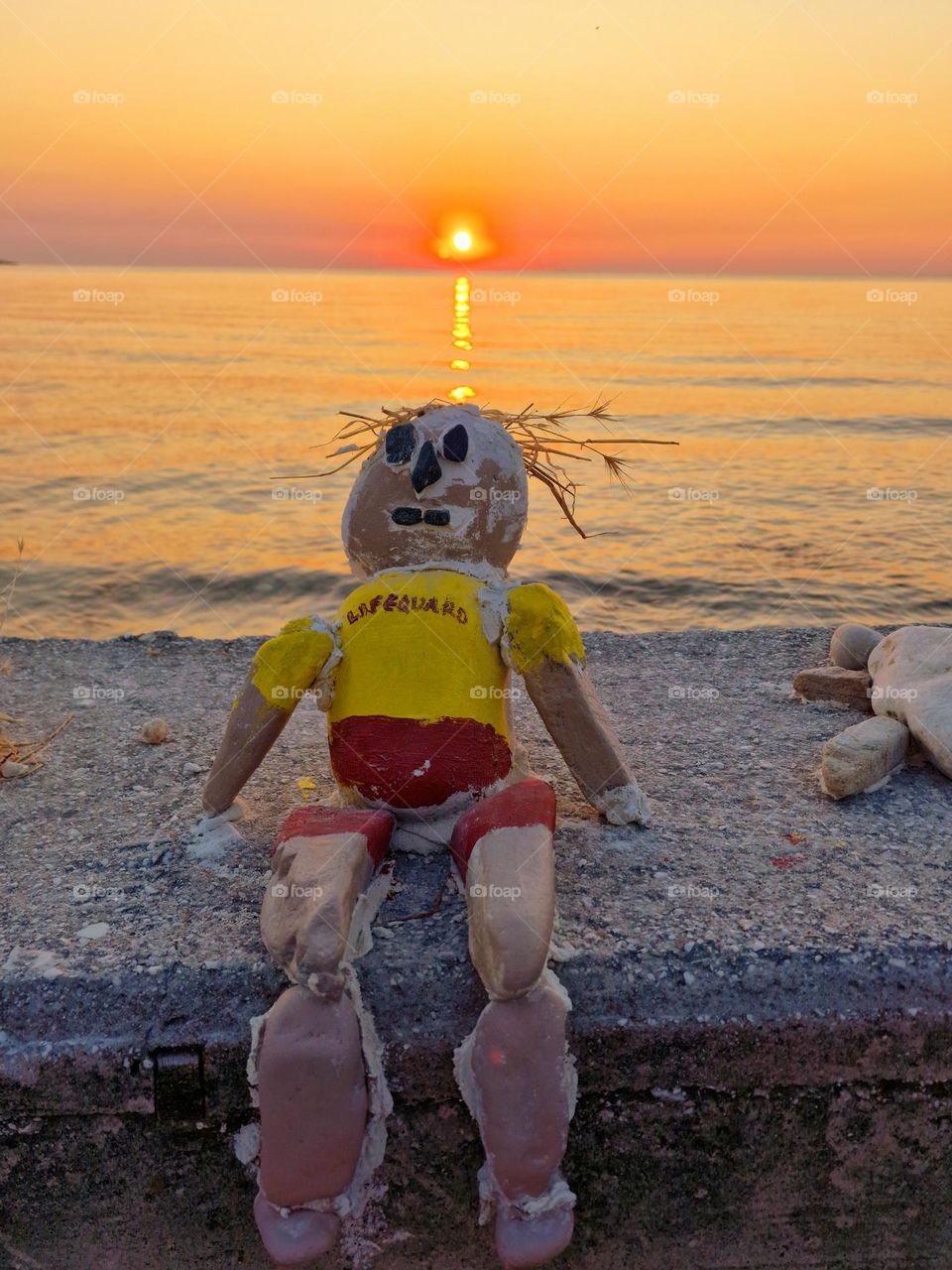 lifeguard doll made of stones