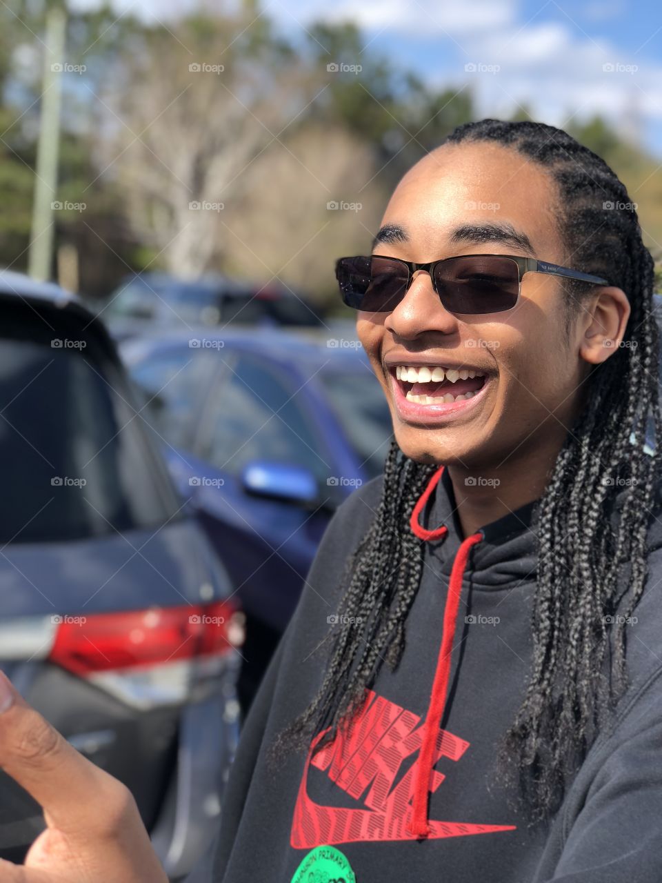 My son smiling after spending time with his little sister at school. 